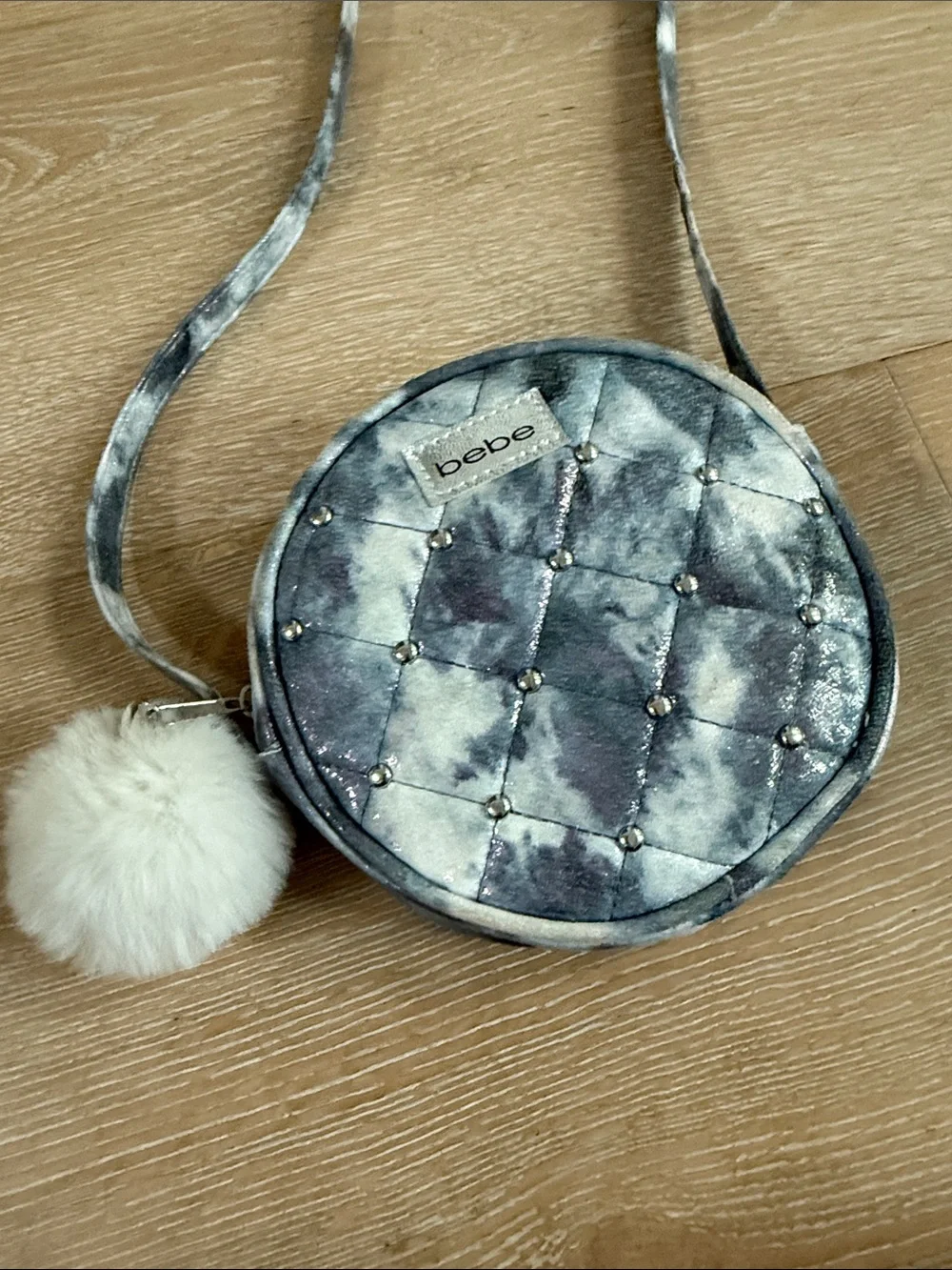 Bebe Quilted Round Crossbody Bag in Silver Gray with Pom Pom